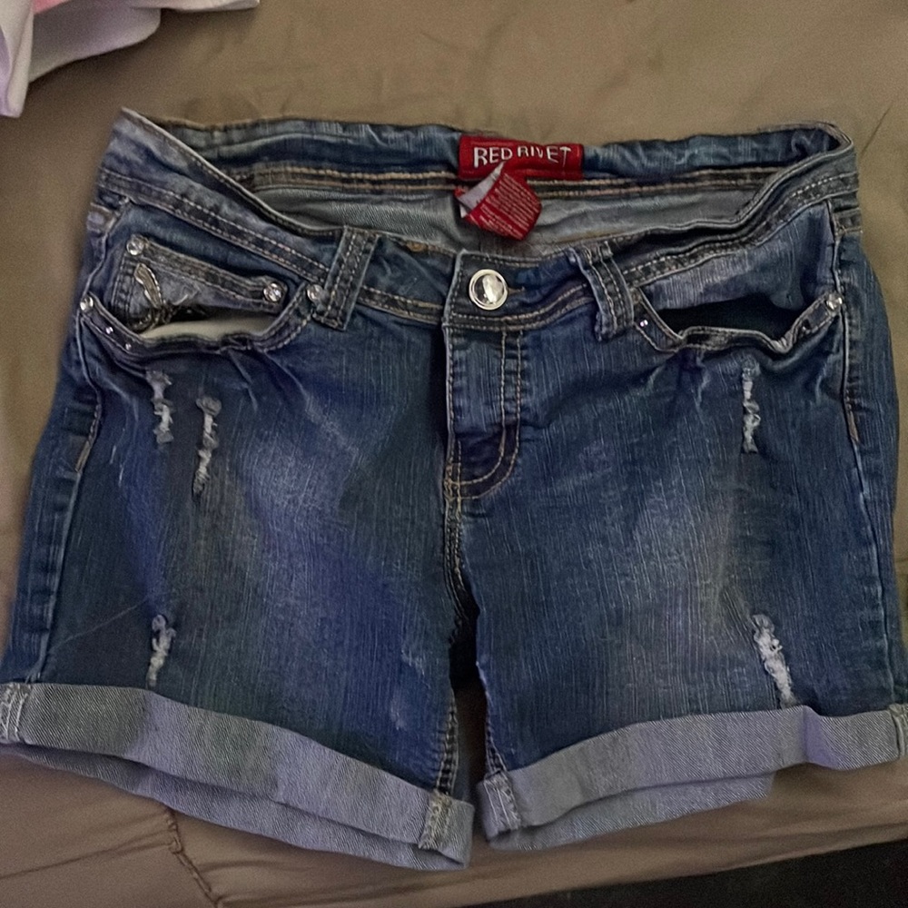 Nice Red Rivet shorts with so much detail in the back pockets,size 11.